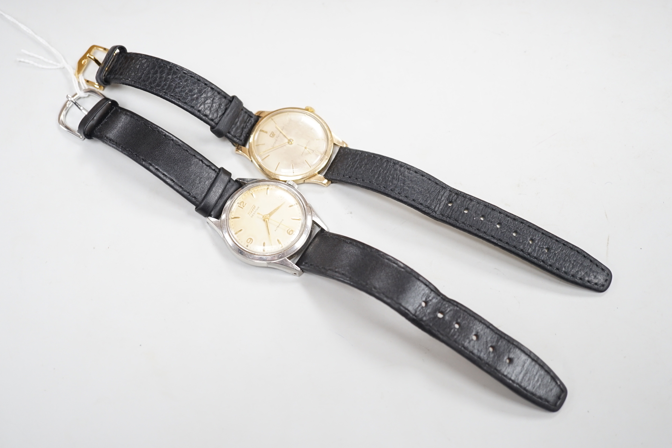 A gentleman's 9ct gold Girard Perregaux manual wind wrist watch, on associated leather strap and a gentleman's stainless steel Tissot Seastar automatic wrist watch.